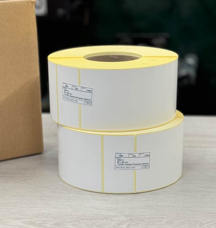 Plain white direct thermal labels on rolls